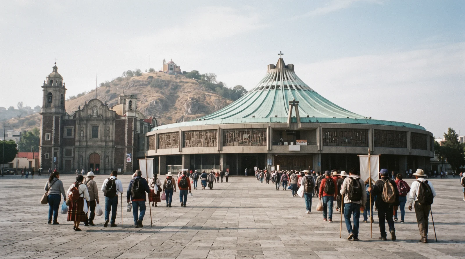 The circular modern Basilica of Our Lady of Guadalupe beside the old sinking basilica on Tepeyac hill, Mexico City