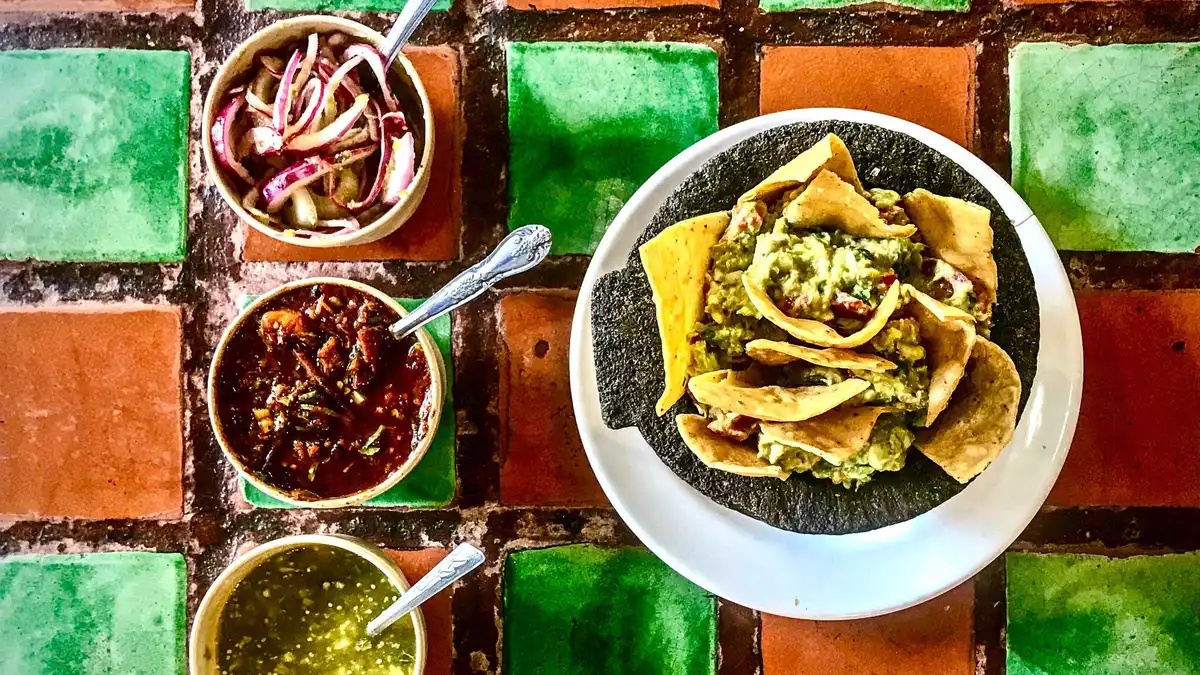 Tacos al pastor coming off the spit on an old town food tour of seven tastings in Mexico City