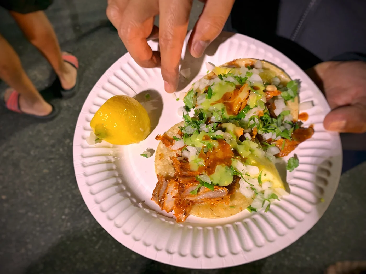 Tacos al pastor with onion, coriander and lime, the emblematic taco of Mexico City